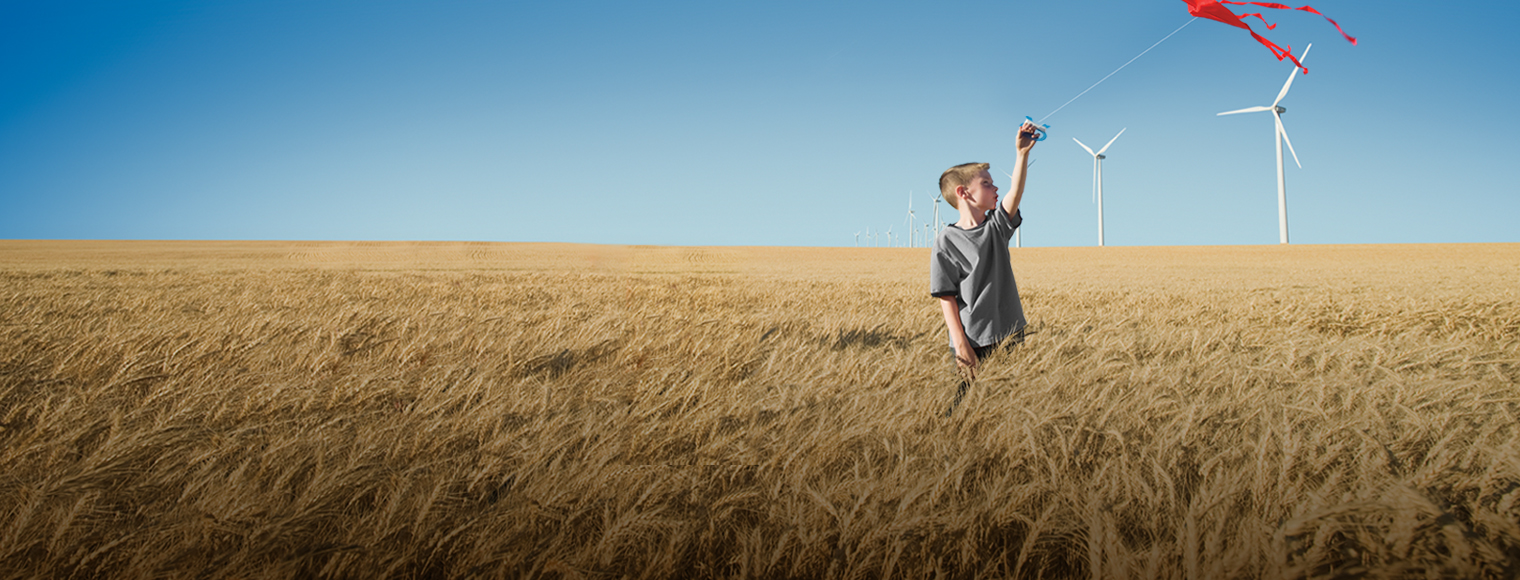 boy holding a red kite, representing HSBC's commitment to sustainability boy holding a red kite, representing HSBC's commitment to sustainability